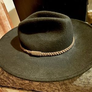 Billabong hat with brown braided trim.